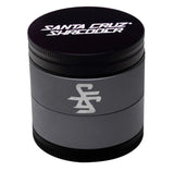 Black and gray grinder with Santa Cruz Surfboards logo on a white background