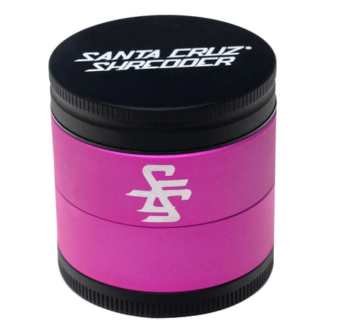 Pink and black Santa Cruz skateboard grinder on a white background